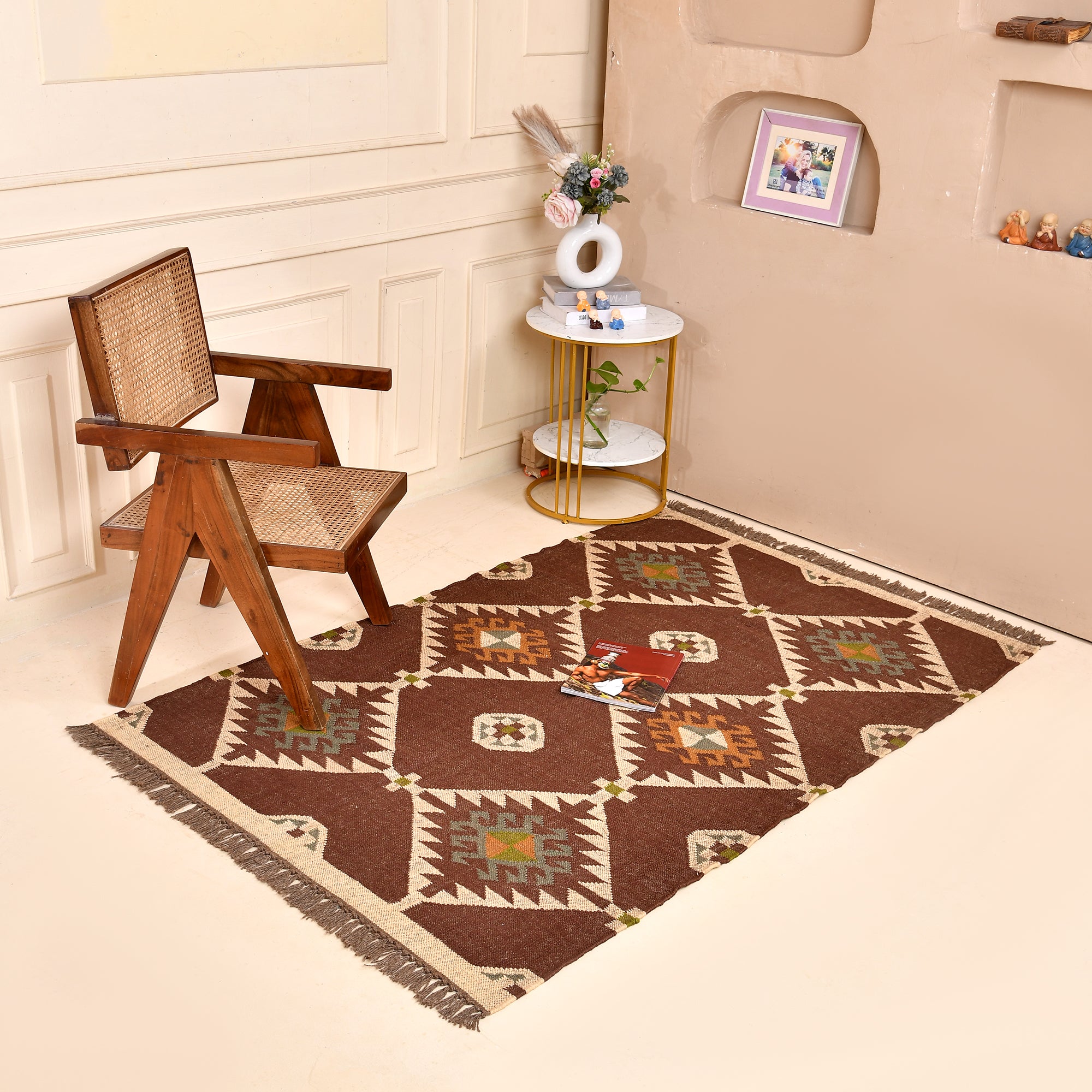 Handmade wool and jute geometric flatweave area rug in brown with tribal-inspired design for living room, bedroom, hallway, and entryway.
