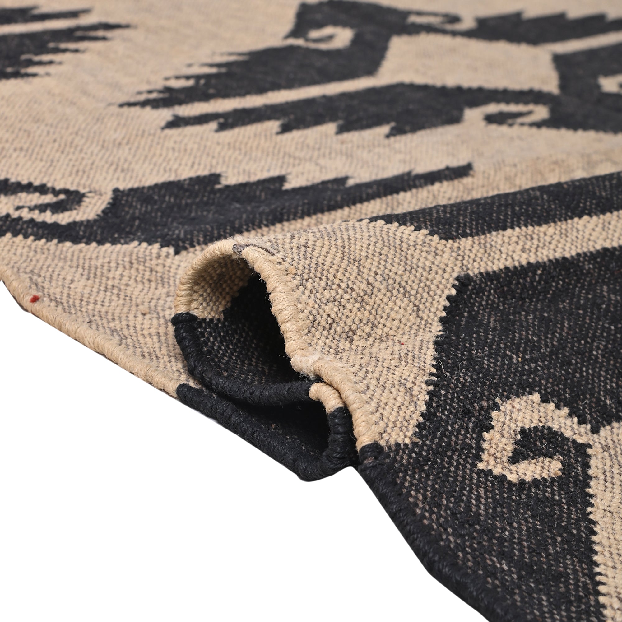Handwoven black and ivory wool jute tribal flatweave area rug for living room and bedroom.