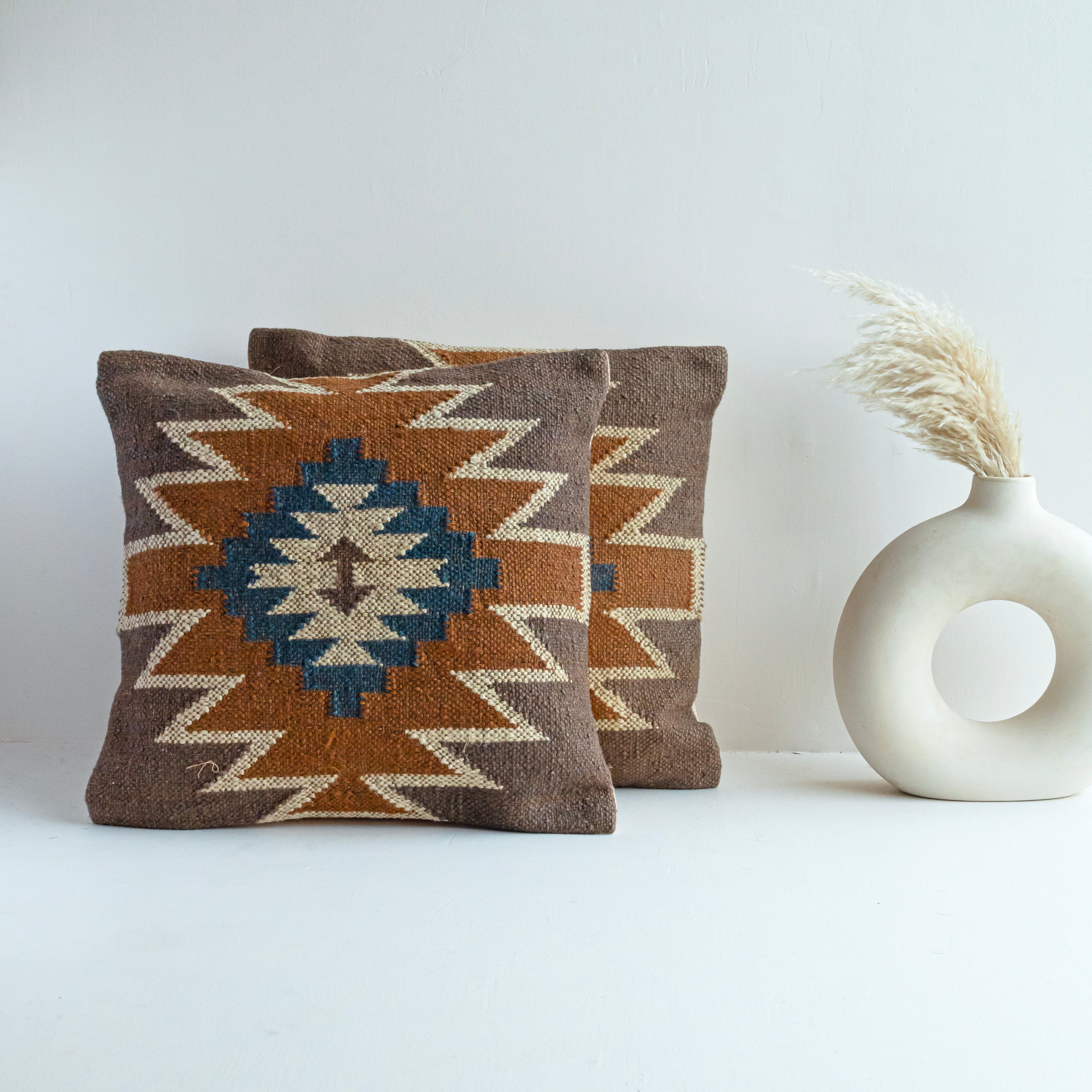 Handwoven brown wool Kilim cushion cover featuring a Southwestern geometric tribal pattern in beige and blue, perfect for boho, farmhouse, rustic, and modern home décor.