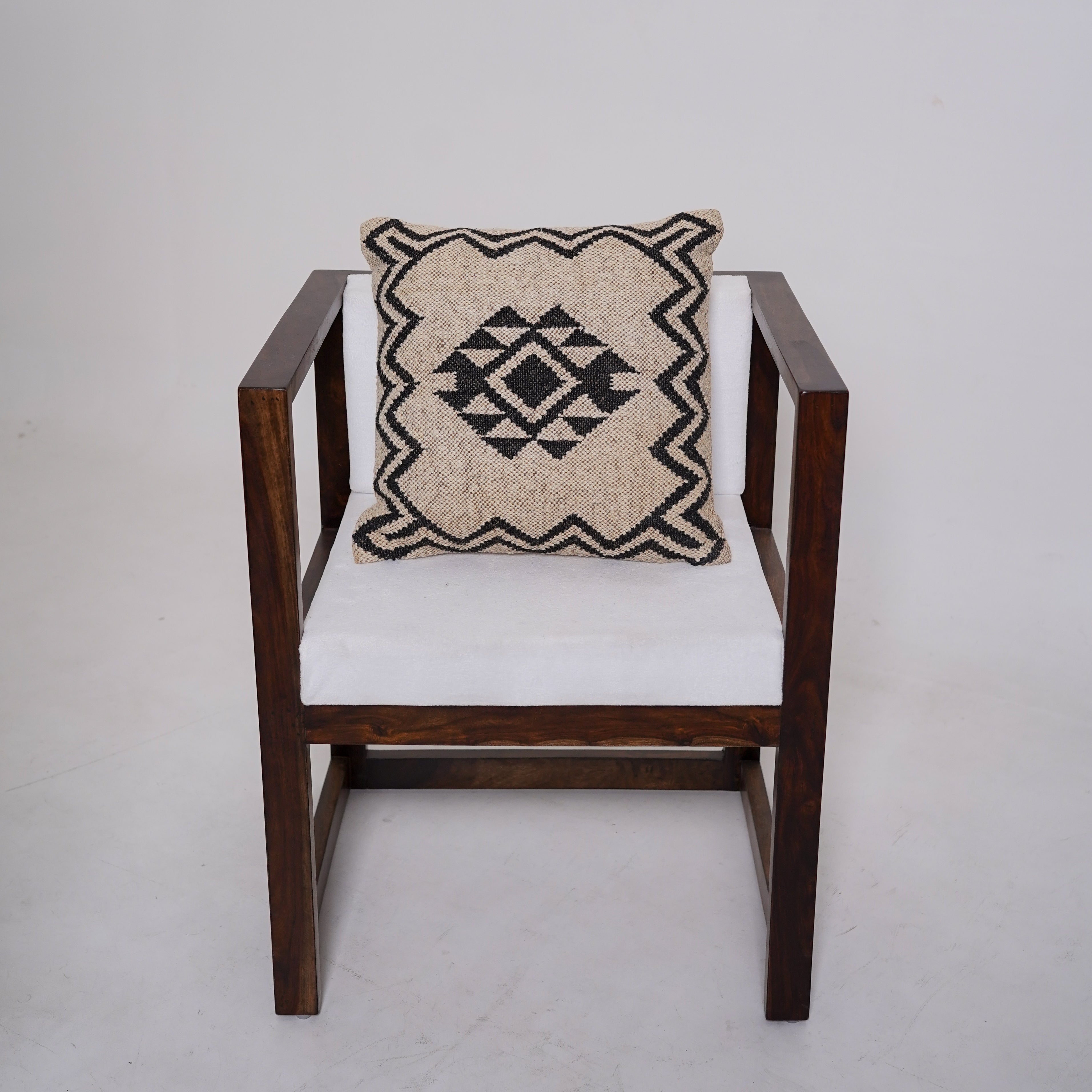 Handwoven black and ivory geometric cotton cushion cover with tribal diamond pattern for boho farmhouse living room décor.