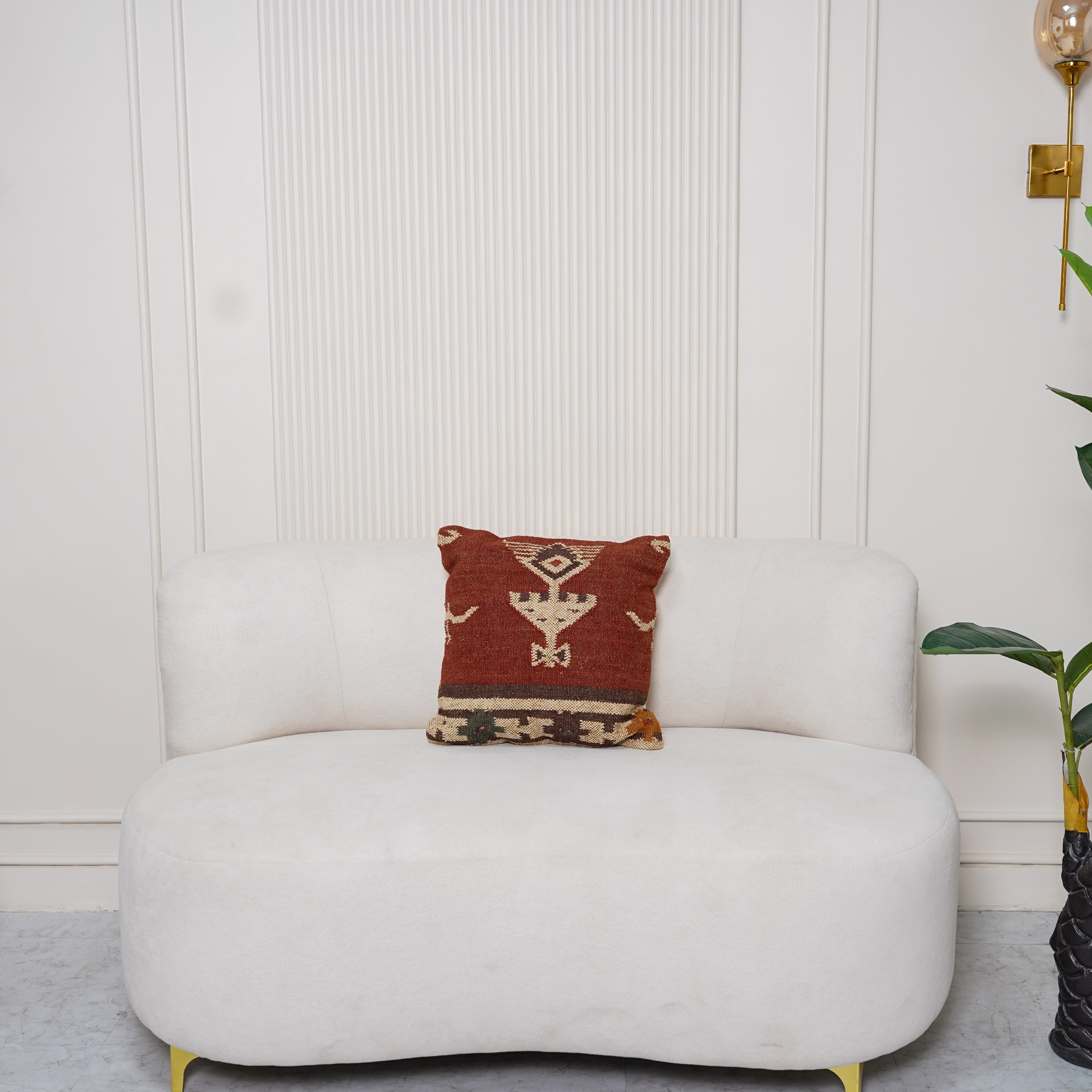 Handwoven rust red wool Kilim cushion cover featuring an ivory Southwestern tribal motif, handmade decorative throw pillow for boho, farmhouse, rustic, and modern home décor.