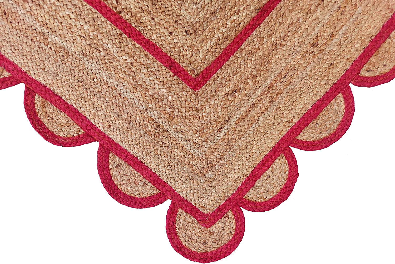Modern living room featuring a handmade natural jute area rug with a red scalloped border, braided texture, wooden furniture, and Scandinavian boho home décor.