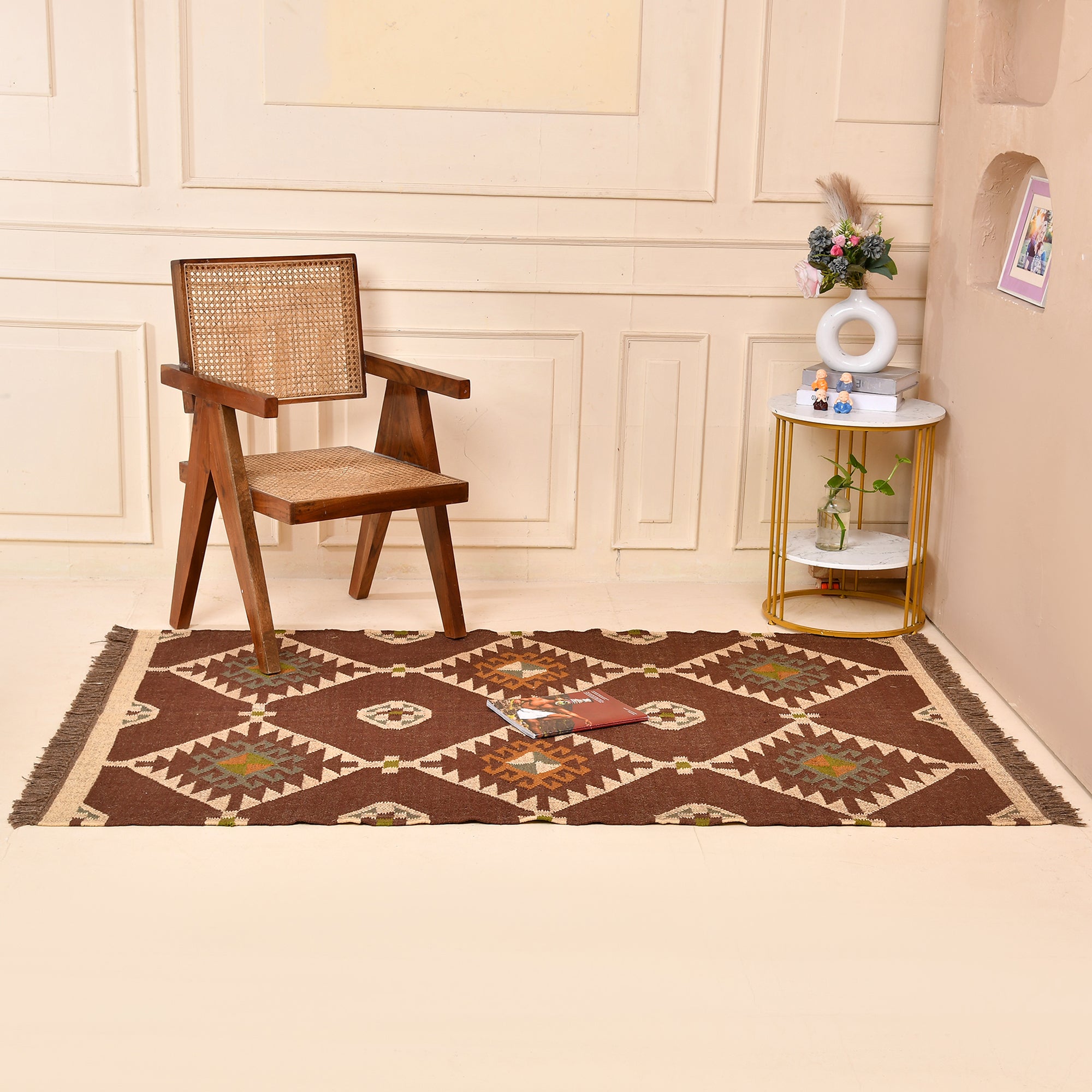 Handmade wool and jute geometric flatweave area rug in brown with tribal-inspired design for living room, bedroom, hallway, and entryway.