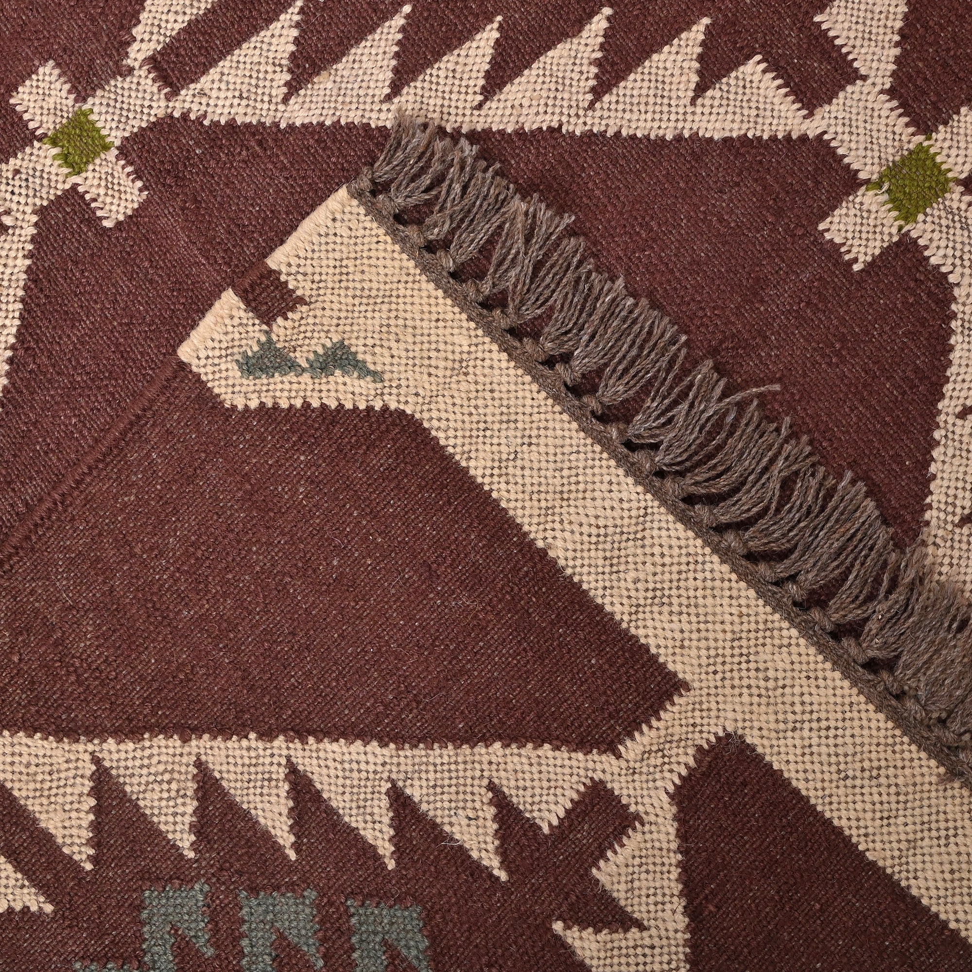 Handmade wool and jute geometric flatweave area rug in brown with tribal-inspired design for living room, bedroom, hallway, and entryway.