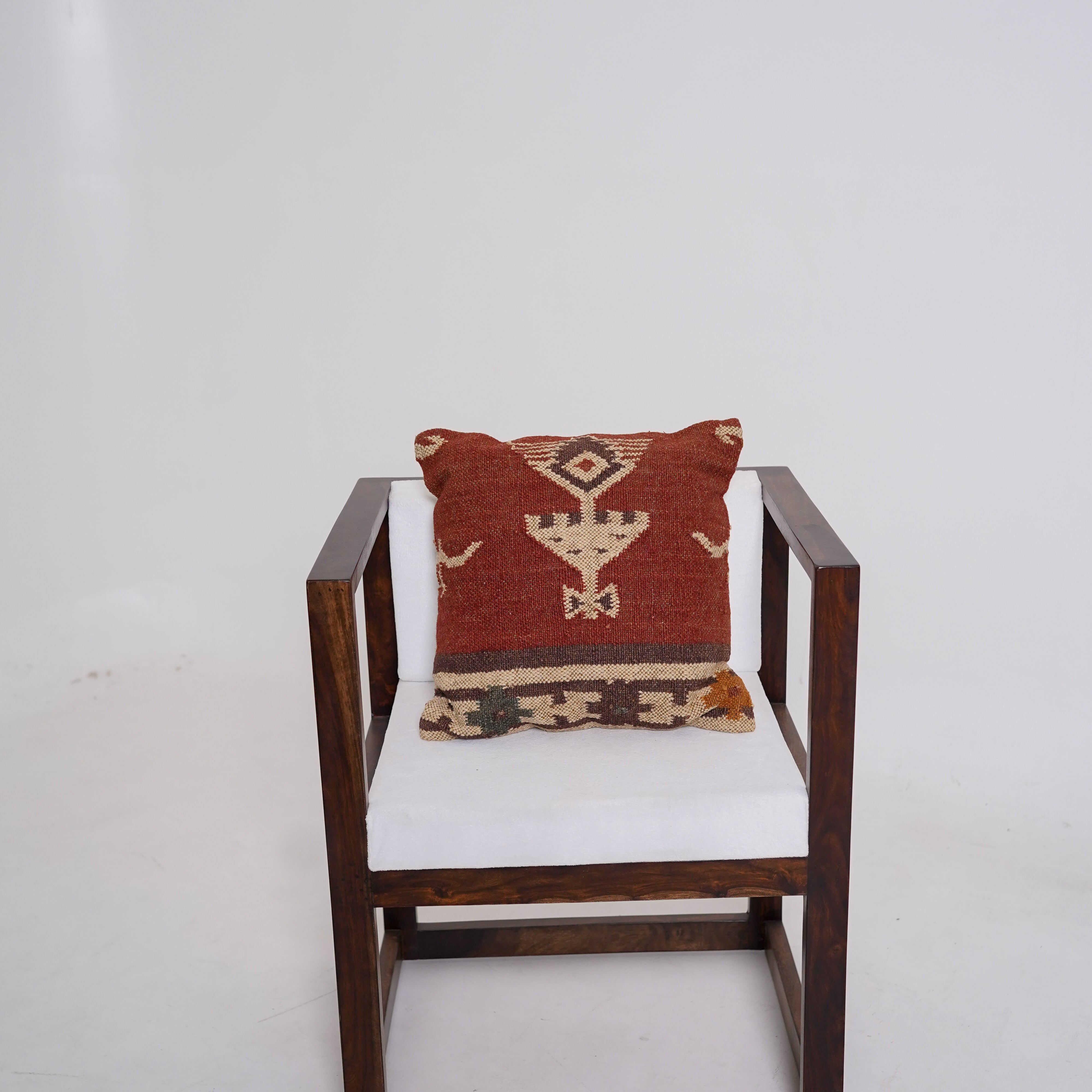 Handwoven rust red wool Kilim cushion cover featuring an ivory Southwestern tribal motif, handmade decorative throw pillow for boho, farmhouse, rustic, and modern home décor.