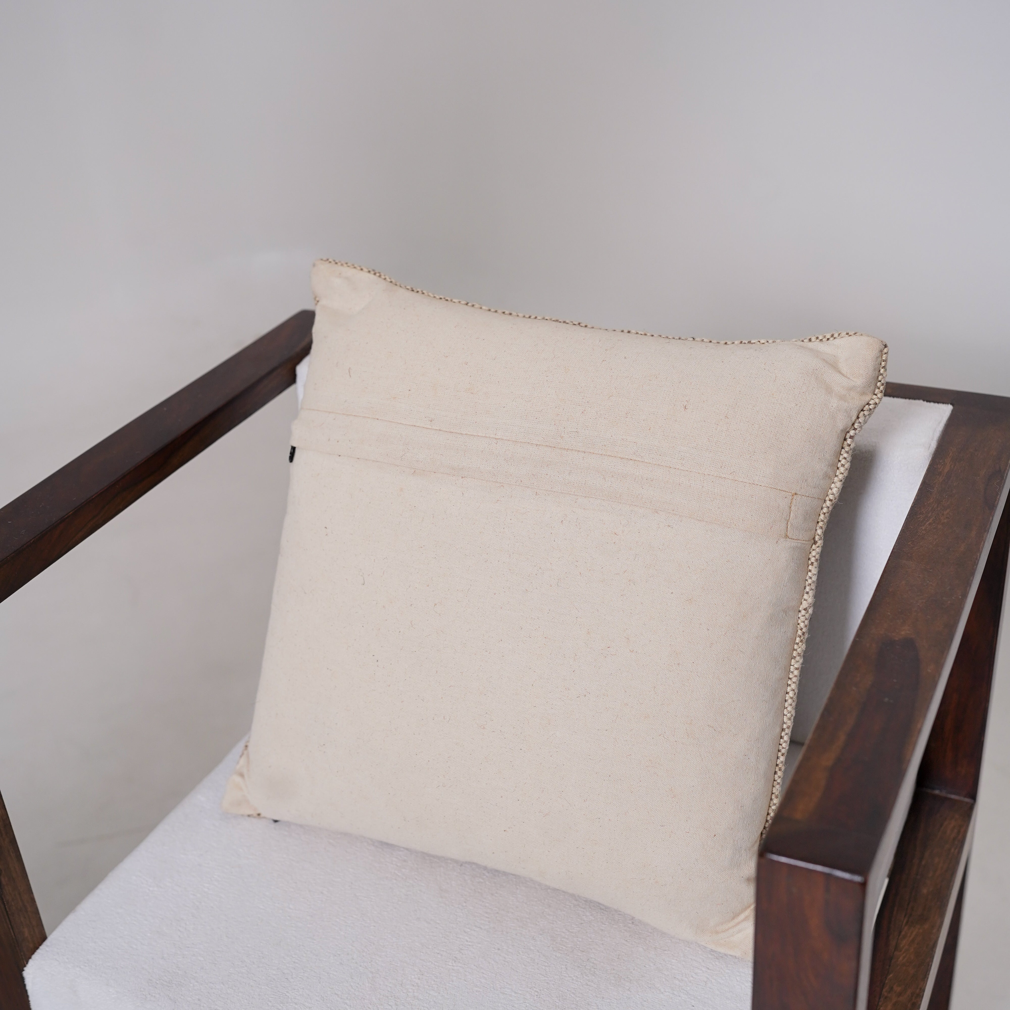 Handwoven black and ivory geometric cotton cushion cover with tribal diamond pattern for boho farmhouse living room décor.