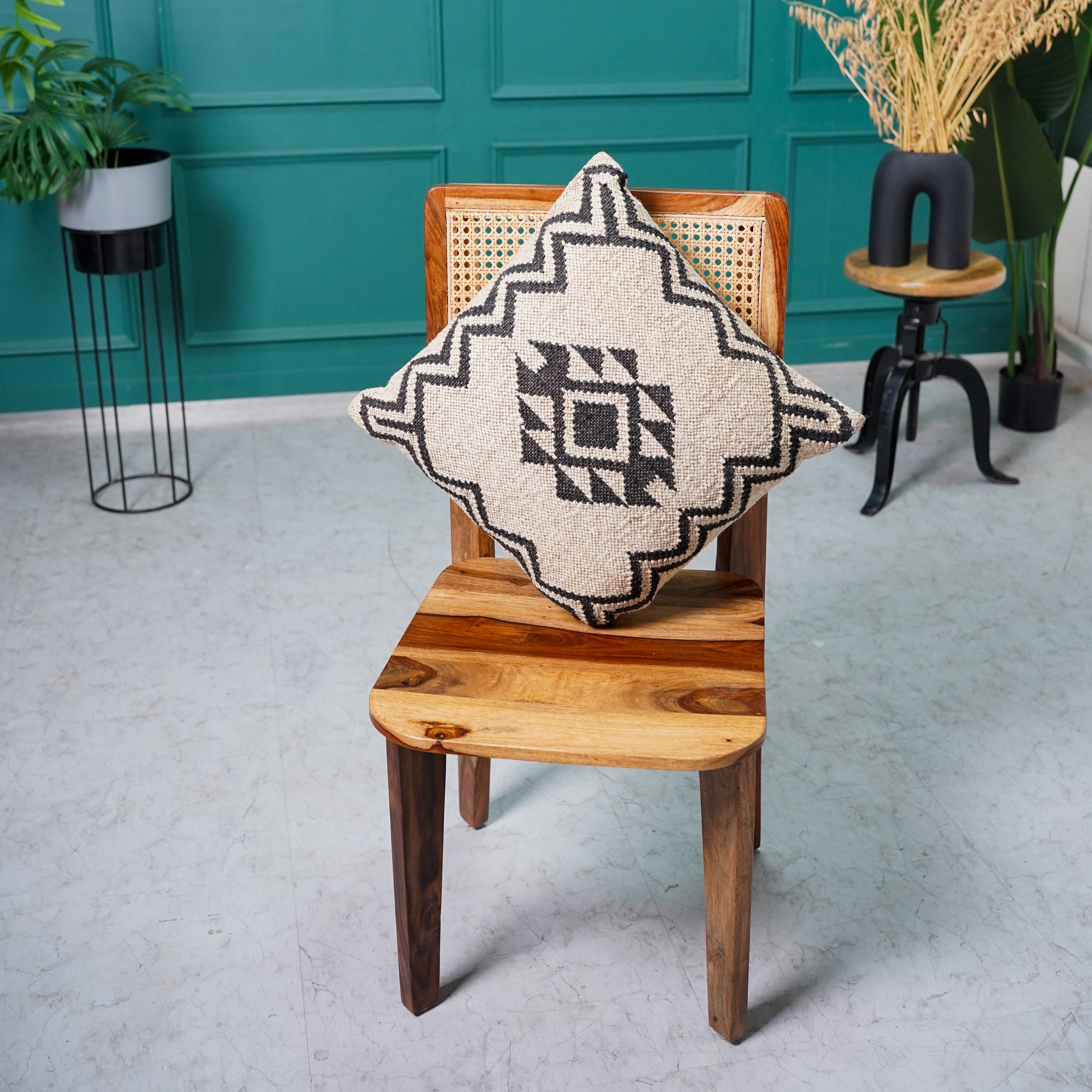Handwoven black and ivory geometric cotton cushion cover with tribal diamond pattern for boho farmhouse living room décor.